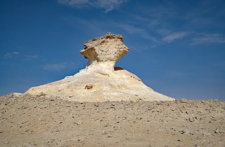 A mushroom shaped limestone formation undercut by wind on the Zekreet peninsula