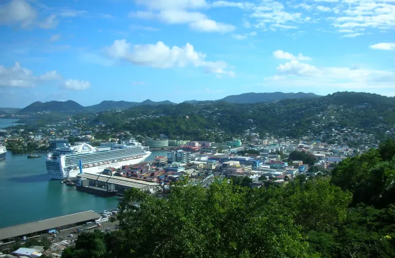 Castries seen from the hillside above, with a cruise ship alongside the port in Saint Lucia.