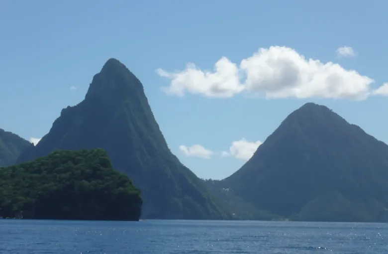 The two Pitons seen across the water from the sea off Saint Lucia.