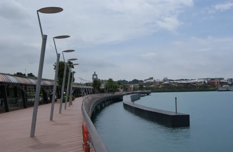 The level, sheltered timber boardwalk that links mainland Singapore to Sentosa, curving along the water with no steps.