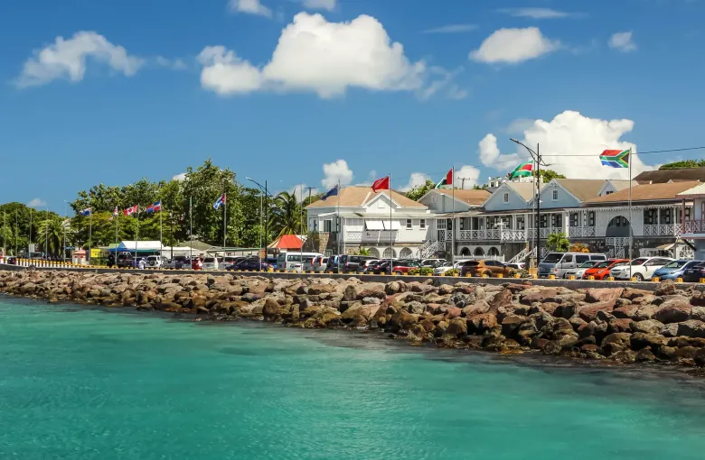 White timber buildings with fretwork verandahs along the Charlestown waterfront on Nevis.