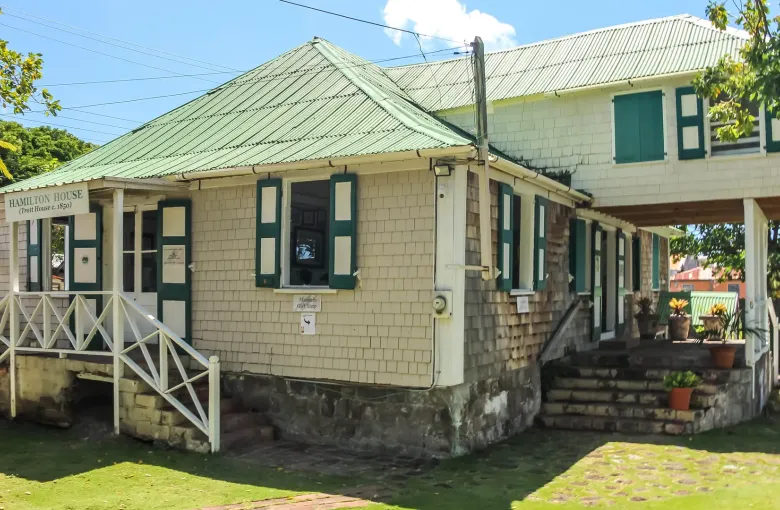 The shingled Museum of Nevis History in Charlestown, its sign reading Hamilton House, Trott House c. 1850.
