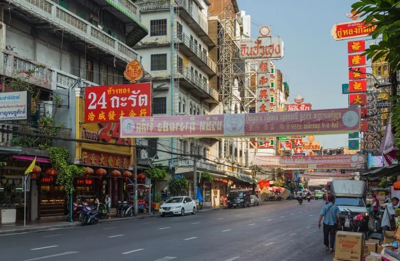 Shopfronts and hanging Chinese signage along Yaowarat Road in the Samphanthawong district of Bangkok.