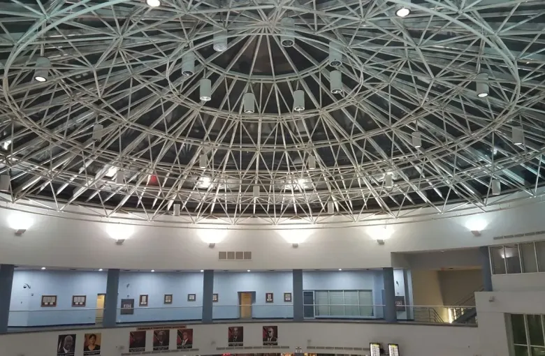 The domed steel lattice roof over the atrium at Piarco International Airport, Trinidad's main gateway.