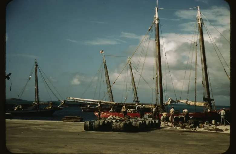 Cargo schooners worked alongside the Christiansted wharf on St Croix in a color photograph from 1941.